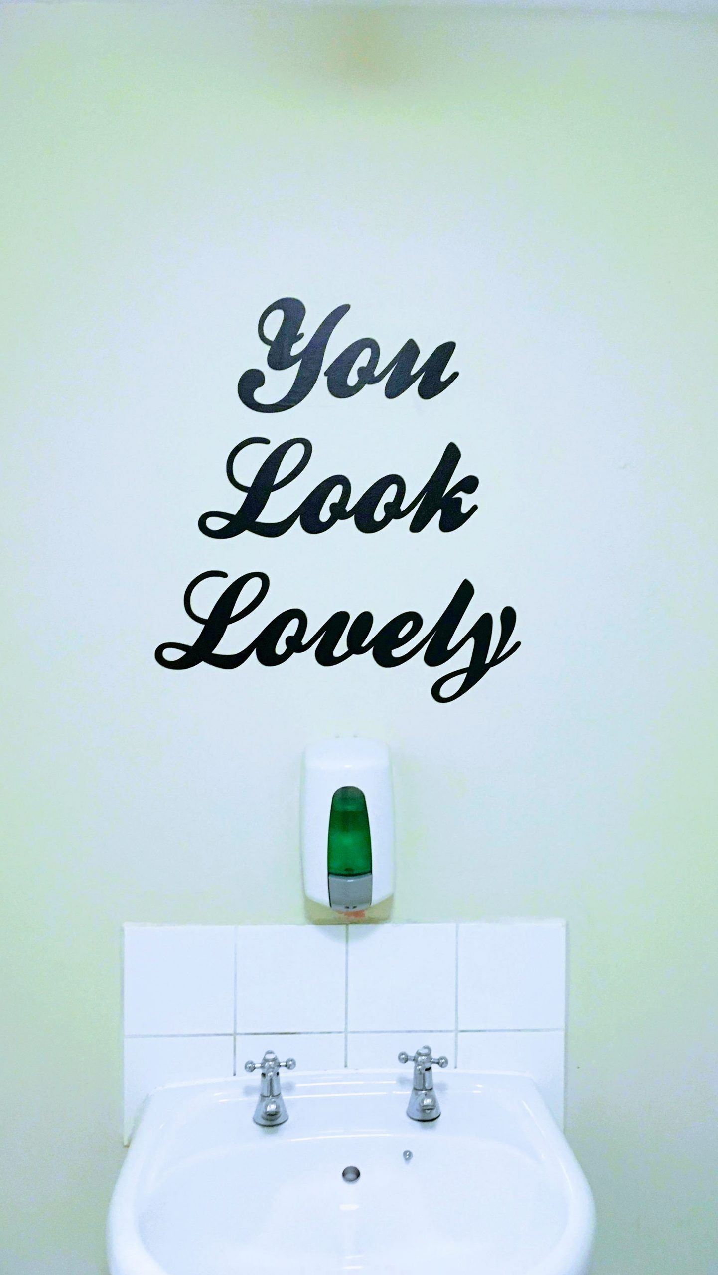 In place of a mirror, the words, "You Look Lovely"